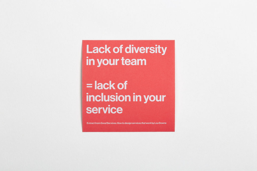 A bright orange square sticker with the words, "Lack of diversity in your team = lack of inclusion in your service" in white type.